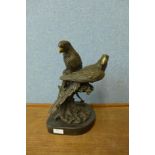 A French style bronze figure of two parrots, on black marble socle, 35cms h