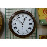 A mahogany circular wall clock