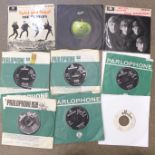 Eighteen Beatles 7" vinyl singles and EPs, mostly in original company sleeves