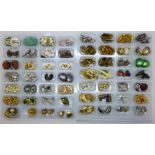 A collection of fifty-six pairs of clip-on earrings, some vintage