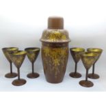 A 1940's Japanned lacquer cocktail set with shaker and six glasses