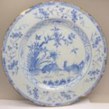 A mid 18th Century Liverpool Delft tin glazed plate with landscape scene of cockerels, the reverse