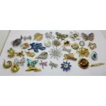 Thirty costume brooches