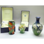 Two small Moorcroft enamel vases including The Awakening 4/50 by Fiona Bakewell, boxed and a small