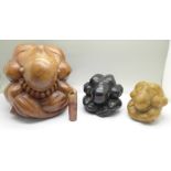 Three carved wooden figures of weeping Buddha and a soapstone seal