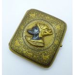 A gilt metal Niello cigarette case, decorated with a gladiator