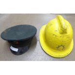 A Fireman's helmet and a peaked uniform cap **PLEASE NOTE THIS LOT IS NOT ELIGIBLE FOR POSTING AND