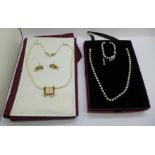 Two pearl jewellery sets, one with silver clasp