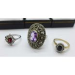 Three rings; a 9ct gold and midnight blue sapphire cluster ring; an attractive large silver