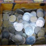 A collection of coins in a wooden box, 6.84kg