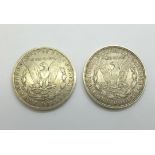 Two US silver dollars, 1882 New Orleans mint and 1921 Denver mint