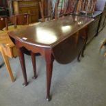 A George II mahogany drop leaf dining table