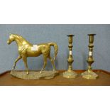 A brass horse and a pair of candlesticks