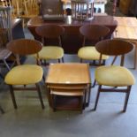 A set of four teak dining chairs and a nest of tables
