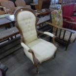 A Victorian carved walnut and fabric upholstered spoonback armchair