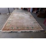A large Chinese pink ground rug