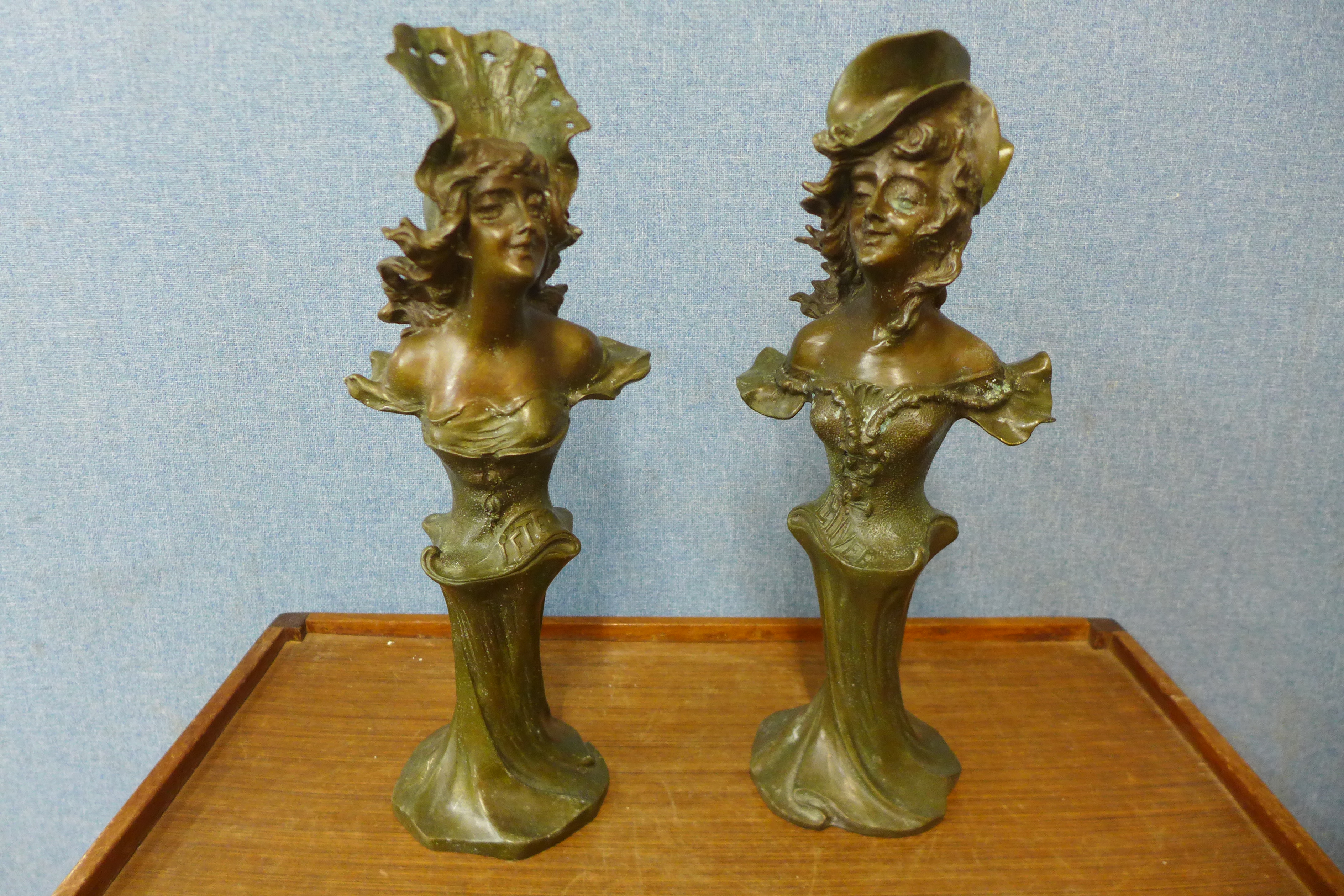 A pair of Art Nouveau style bronze busts, 45cms h