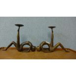 A pair of bronze figural candle stands