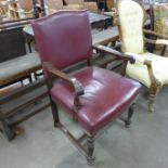 An early 20th Century mahogany and upholstered library armchair