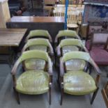 A set of six mahogany and green leather library chairs