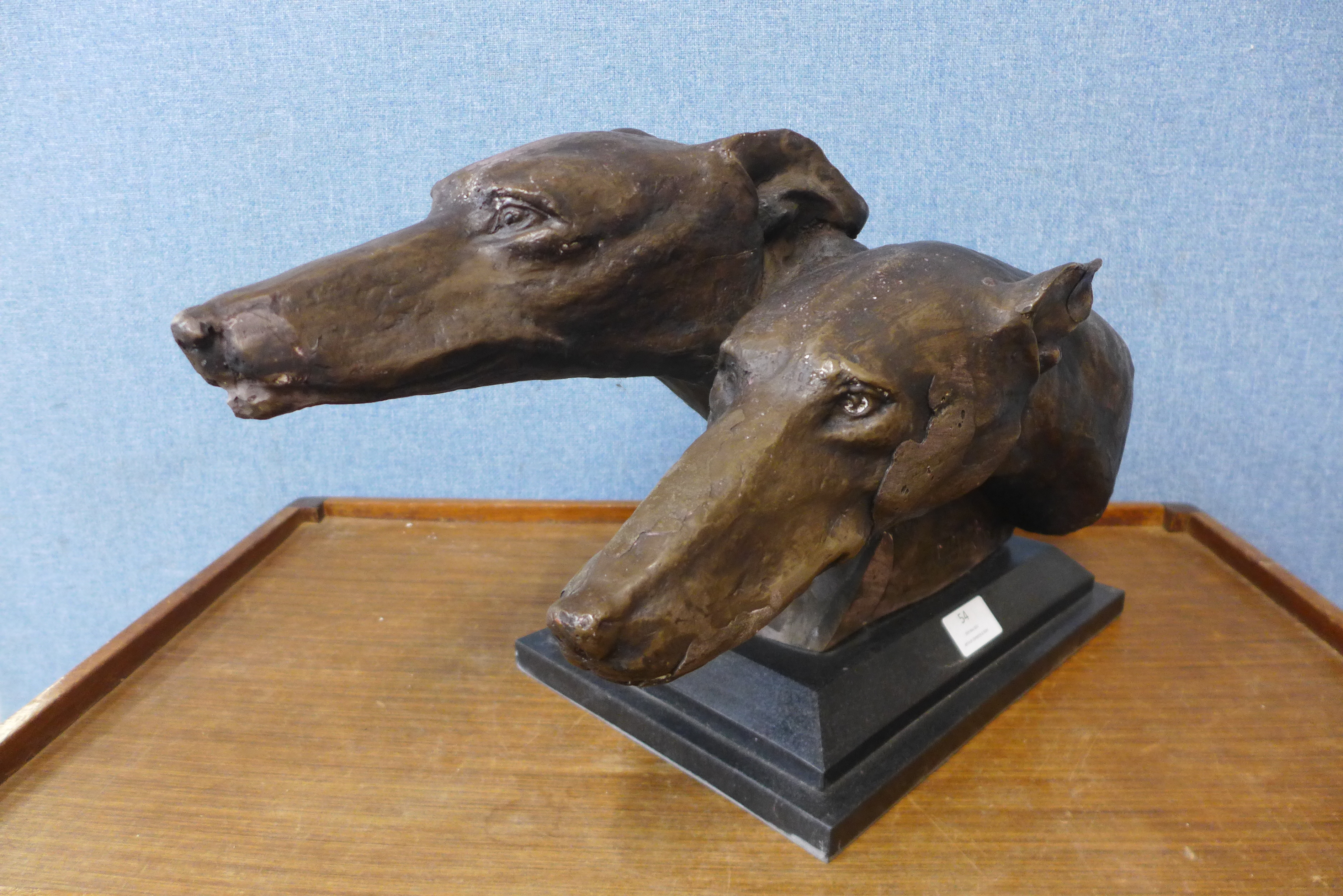 A bronzed bust of two greyhounds