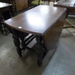 A carved oak gateleg table