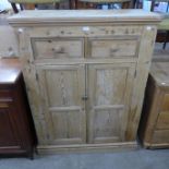 A pine housekeeper's cabinet