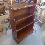 A mahogany open bookcase