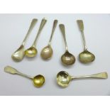 Seven silver condiment spoons including two 19th Century, (one marked 830), 37g