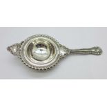 A silver tea strainer, Birmingham 1910, 33g