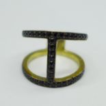 A silver gilt and black spinel ring, N