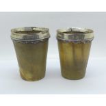A pair of 19th Century white metal mounted horn cups, 10.5cm