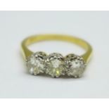 An 18ct gold, three stone diamond ring, approximately 1carat total diamond weight, 3.4g, O