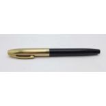 A Sheaffer pump action pen with 14k gold nib