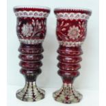 A pair of Bohemian ruby flash cut glass vases, 32.5cm