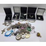 A collection of mainly silver jewellery, etc., including two charm bracelets, chains, pendants