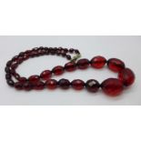 A string of faceted sherry amber coloured beads