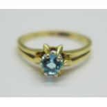 A 10k gold and blue stone solitaire ring, 2.7g, S