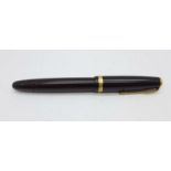 A Parker Duofold pen with 14k nib and pump action