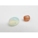 Two gemstones, 0.51ct orange sapphire and 0.80ct natural opal white, with GJSPC gemstone reports