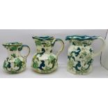 A set of three Mason's Chartreuse graduated jugs