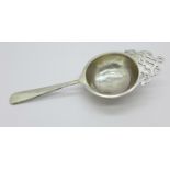 A silver tea strainer, Birmingham 1913, 38g