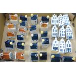 Thirty-two KLM Bols Delft blue and white buildings decanters