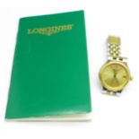 A lady's Longines wristwatch with papers