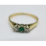 An 18ct gold, emerald and diamond three stone ring, 1.7g, N