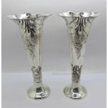 A pair of Victorian silver vases, Birmingham 1899, 18cm, weighted