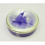 A circular silver and enamel box, import mark for London 1923, diameter 54mm, (three chips to the