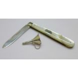 A silver scent bottle funnel and a Victorian silver bladed and mother of pearl fruit knife