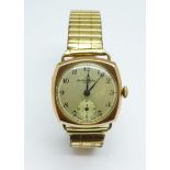 A 9ct gold cased wristwatch, Thomas Russell & Son, London 1945, on a Fixoflex bracelet strap, 28mm