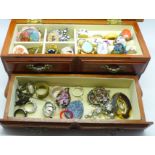 A small cabinet of costume jewellery